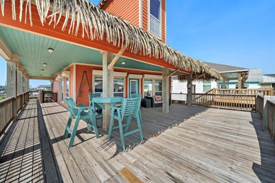 Sit at the fun built in Pub table and listen to the breeze rustle the Palapa! Lots of room on the huge Deck for all your friends. | Image 2