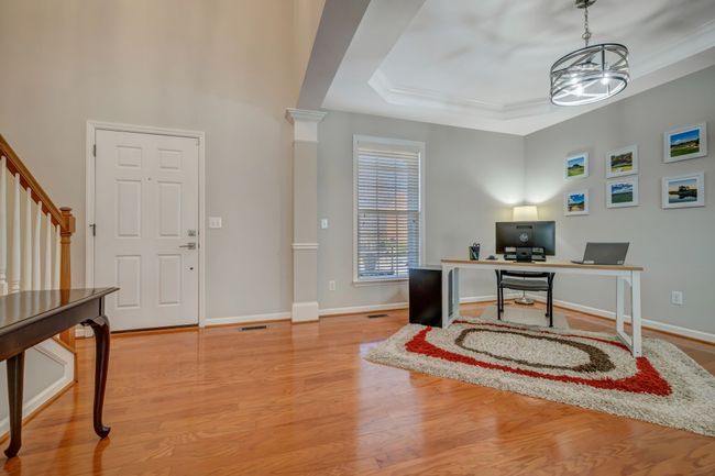 The large dining room is currently being used as an office. | Image 22