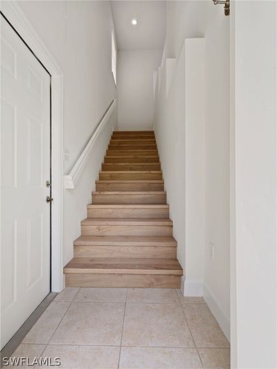 Stairway featuring light tile patterned floors | Image 2