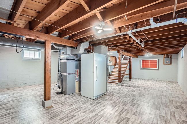 Over 700' in basement ready finish bringing the home to about 2, 100 finished sq. ft.!to New Vinyl Flooring, Stand-Up Freezer Included! | Image 20