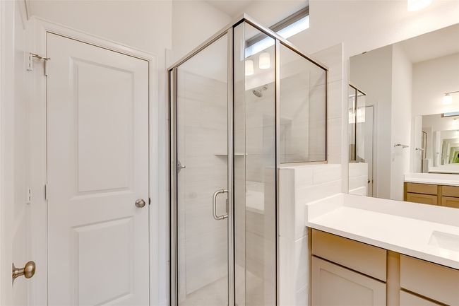 Bathroom featuring a stall shower and vanity | Image 20