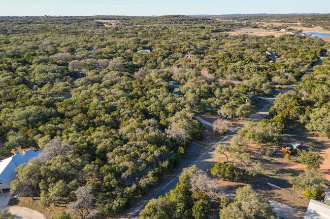 Lot has 125' frontage on Ridge Oak. Located to right of utility pole and before the circular drive to the right. | Image 12