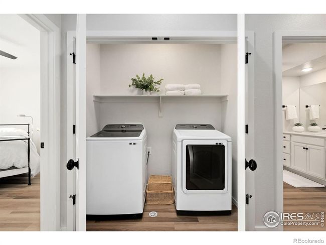 Roomy Laundry area with double doors, upgraded black matte hardware throughout home | Image 18