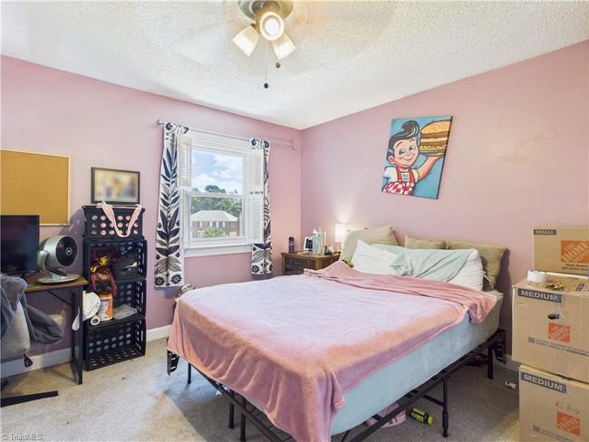 Nicely situated bedroom with a nice view into the back yard. | Image 22