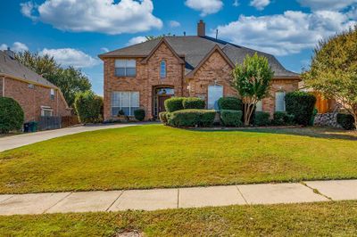 View of front of home featuring a front yard | Image 1