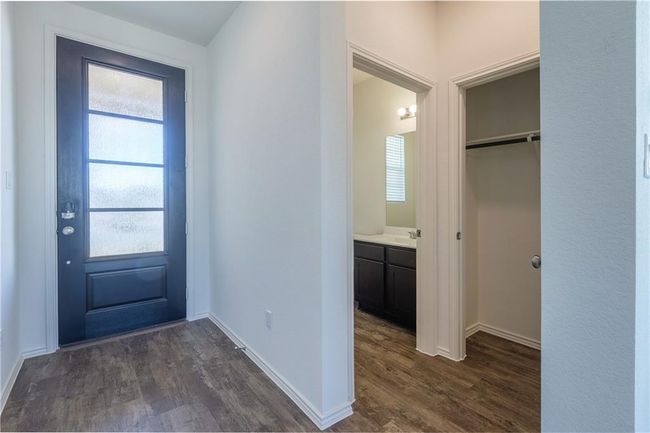 Entrance foyer featuring dark wood finished floors and baseboards | Image 19