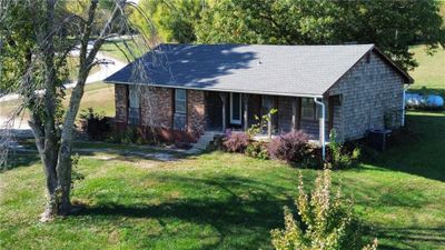 Ranch-style house, front lawn, and porch | Image 1