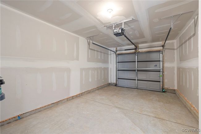 Garage featuring a garage door opener | Image 24