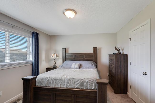 The primary bedroom includes a large walk-in closet, providing ample storage and organization space. | Image 19