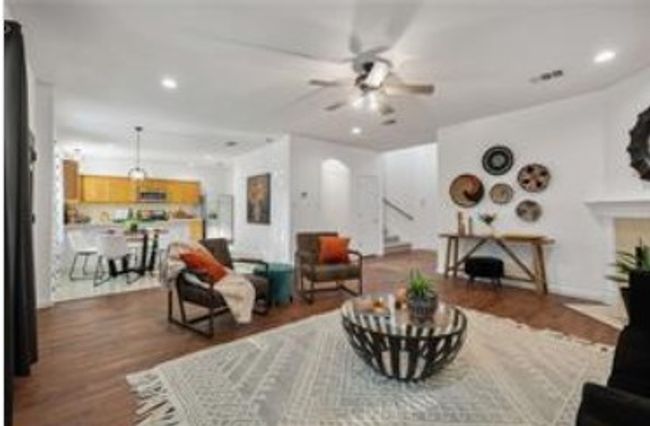Living area featuring stairway, baseboards, recessed lighting, wood finished floors, and a ceiling fan | Image 5