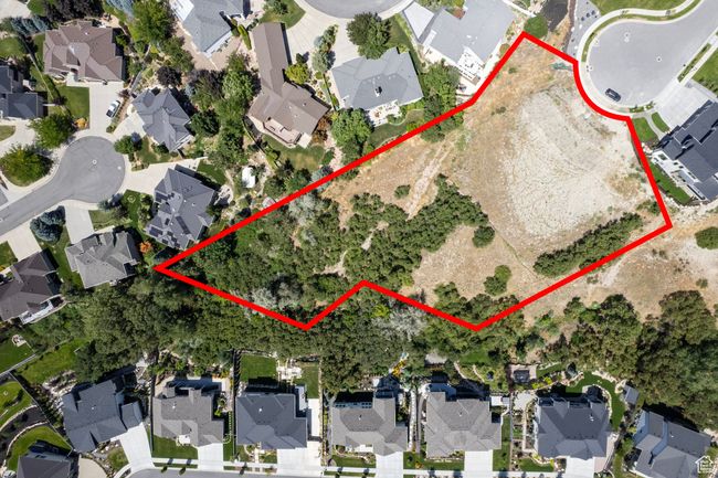 Aerial perspective of suburban area featuring property parcel outlined | Image 6