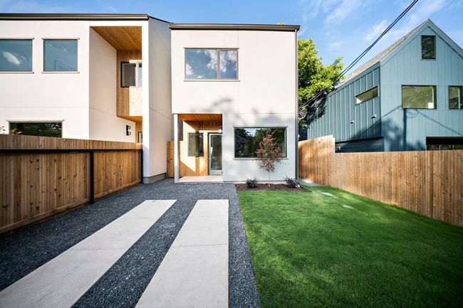 Rear view of property with stucco siding | Image 17