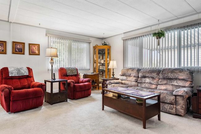 Living room featuring carpet flooring | Image 7