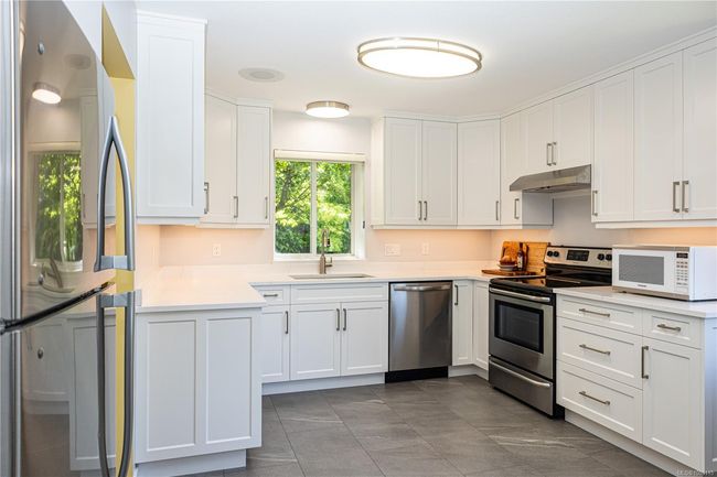 Tile backsplash and ceiling height cabinets | Image 7