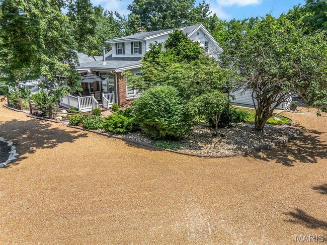 Obstructed view of property with brick siding | Image 5