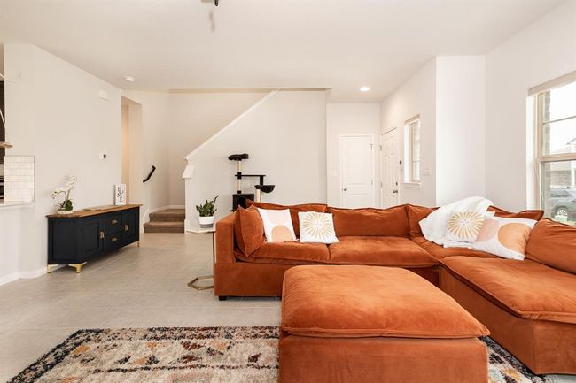 Living area featuring stairway, light tile patterned floors, and recessed lighting | Image 12
