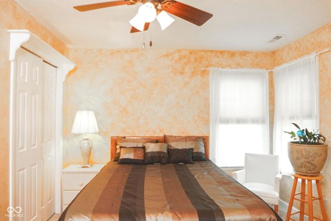 bedroom with a ceiling fan and french doors | Image 27