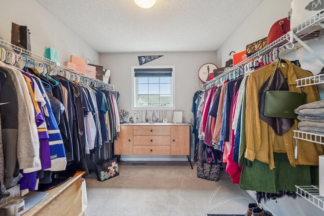 Large walk-in primary closet | Image 24