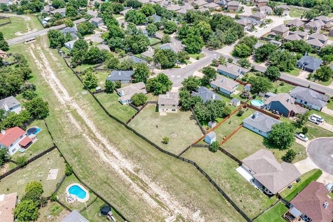Ariel view of home and greenspace behind | Image 24