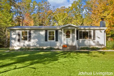 8673 Loveless Drive, House other with 3 bedrooms, 2 bathrooms and null parking in Howard City MI | Image 1