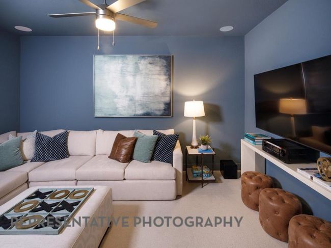 Living area with a ceiling fan and carpet | Image 31