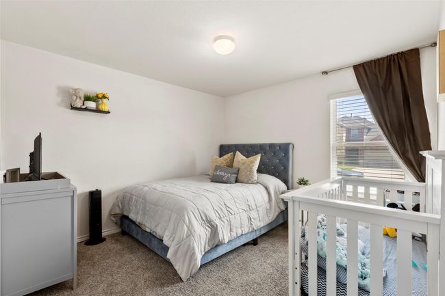 Bedroom featuring baseboards and carpet flooring | Image 24