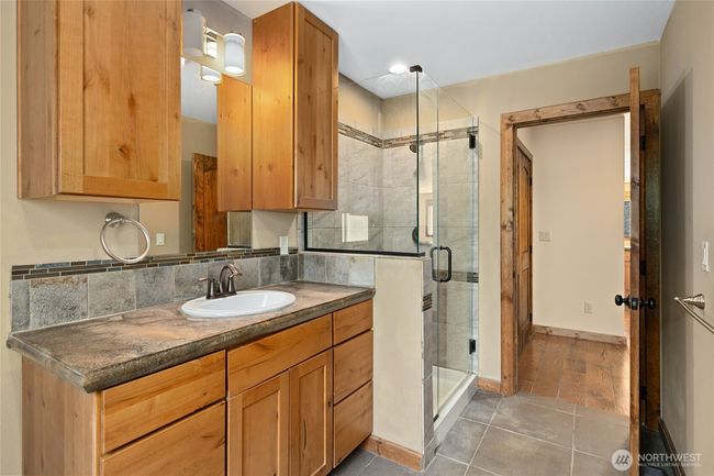 Walk in shower and great cabinet space. | Image 10