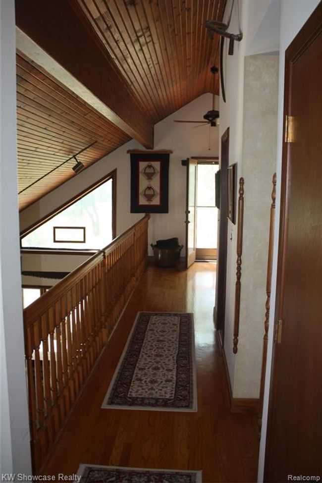 Hallway from bedrooms to bathroom and loft area. | Image 38