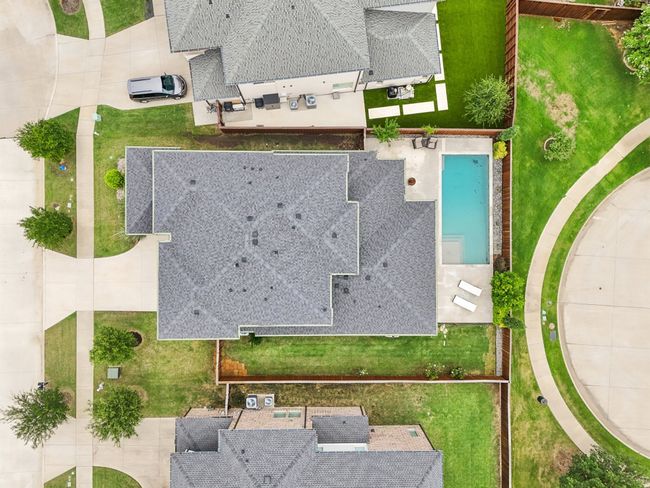 Aerial view of property and surrounding area with a pool area | Image 37
