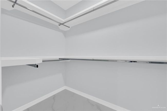 Spacious closet with marble finish floor | Image 20