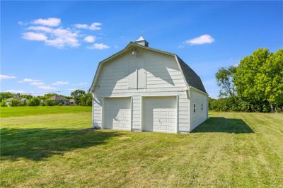 Garage featuring a yard | Image 3