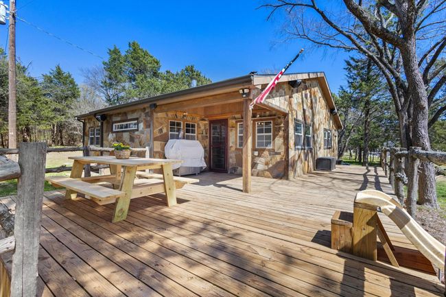 Wooden deck featuring a grill | Image 17