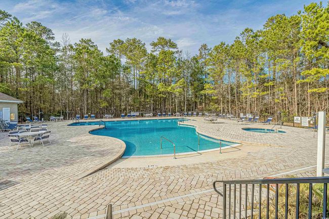 Community pool with a patio area | Image 38