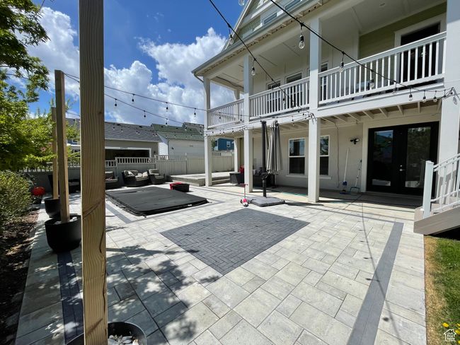 View of in ground spa with outdoor lounge area, a patio area, and fence | Image 71