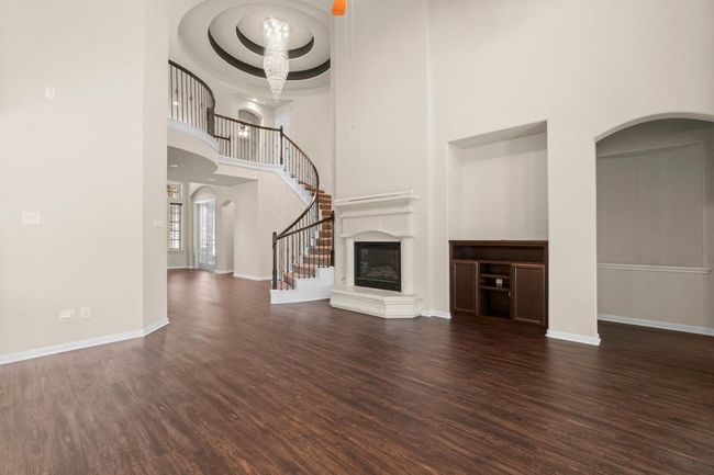 Family room and staircase with gorgeous chandelier | Image 7