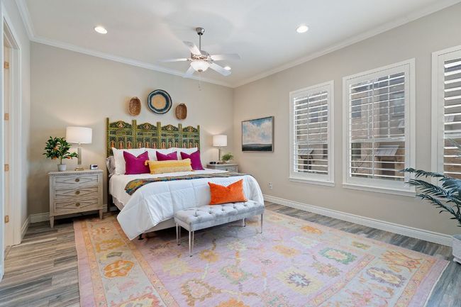 2nd Floor Primary Bedroom with crown molding, baseboards, wood finished floors, and recessed lighting | Image 4