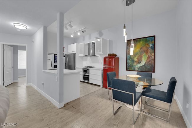 Dining space featuring light wood-style flooring and baseboards | Image 9