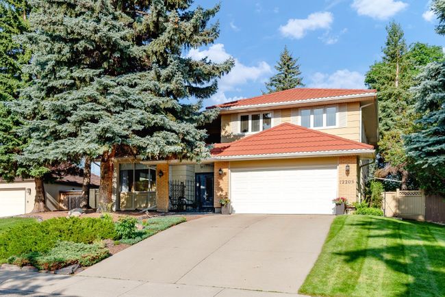 12208 Lake Louise Way Se, Home with 5 bedrooms, 3 bathrooms and 2 parking in Calgary AB | Image 1