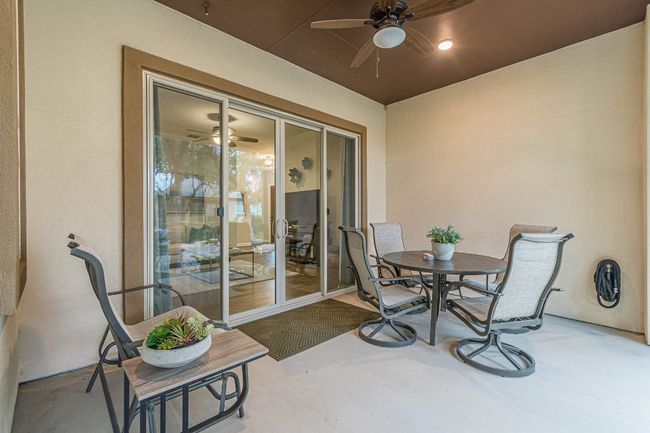 Sunroom featuring ceiling fan and outdoor dining space | Image 34