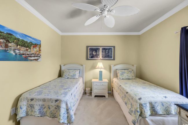 Carpeted bedroom with ornamental molding and a ceiling fan | Image 20