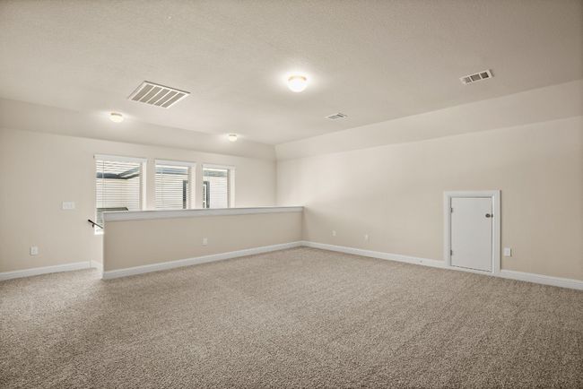 Empty room featuring visible vents, baseboards, and light carpet | Image 20