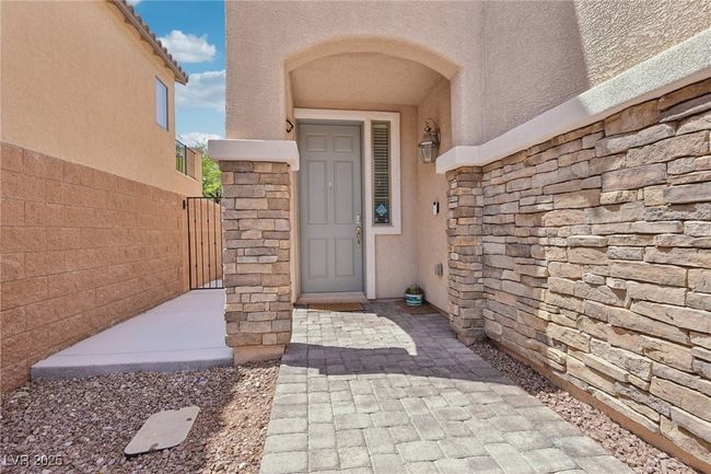 Property entrance featuring stucco siding and stone siding | Image 4