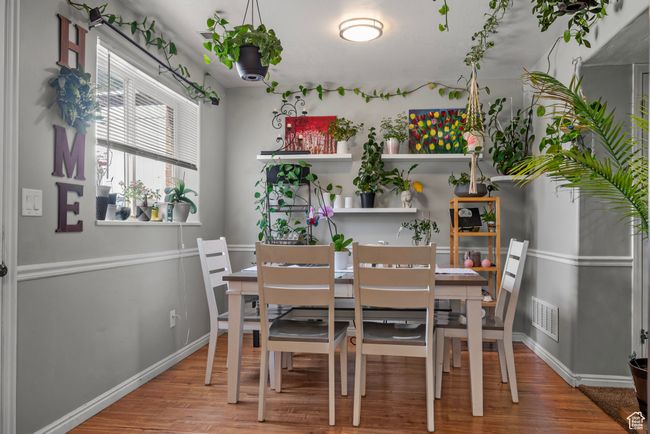 Dining area featuring wood finished floors | Image 7