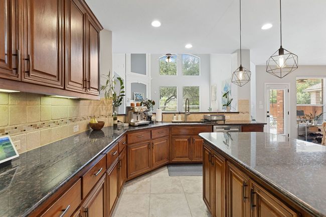 Under cabinet lighting adds a nice accent to an already stunning kitchen. | Image 14