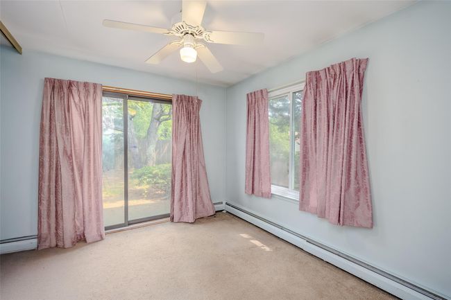 Carpeted bedroom featuring baseboards and ceiling fan | Image 27