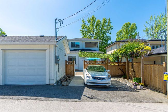 View of front of property featuring a garage | Image 20