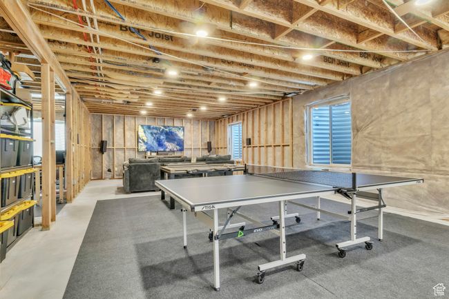 Game room featuring finished concrete floors | Image 26