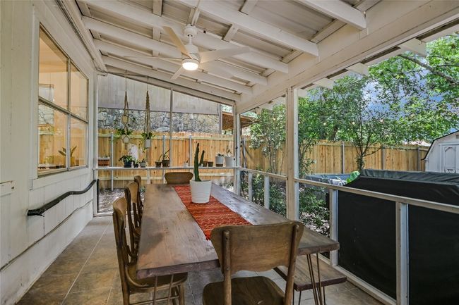 An expansive fully enclosed screened-in back patio extends your dining and entertainment space. | Image 17