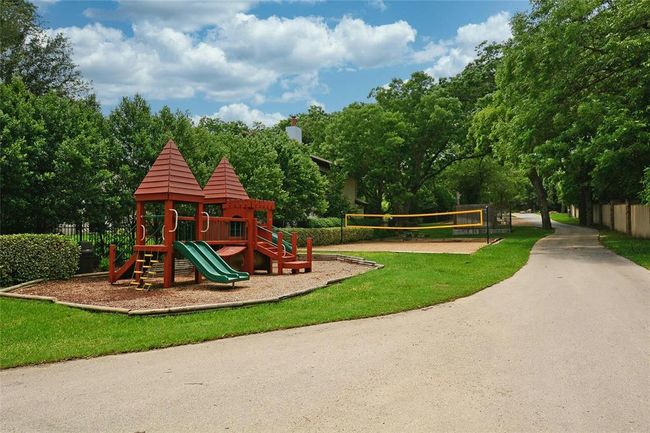 Communal playground featuring volleyball court | Image 28