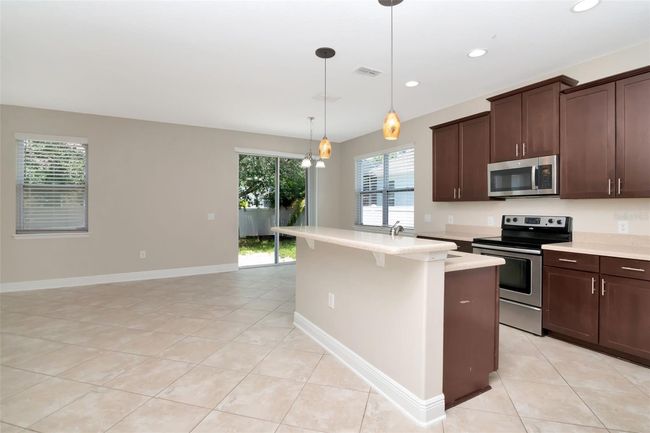 7703 S Fitzgerald St, House other with 4 bedrooms, 3 bathrooms and null parking in Tampa FL | Image 5